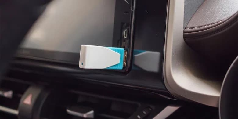 USB configuration stick plugged into car infotainment USB port